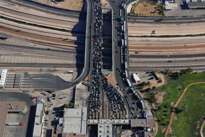 Framed Print : Automobiles pass through the U. S. border and into the United States from Juarez