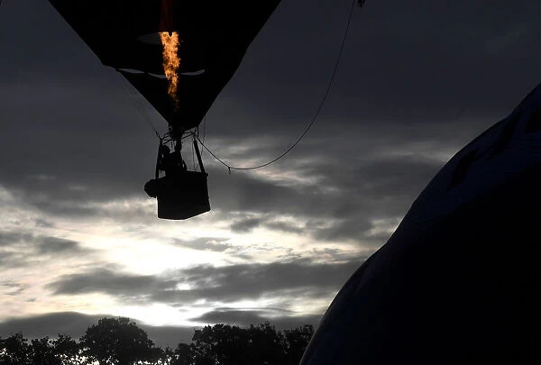 Balloons launch during a mass take off at the annual Bristol hot air balloon festival in