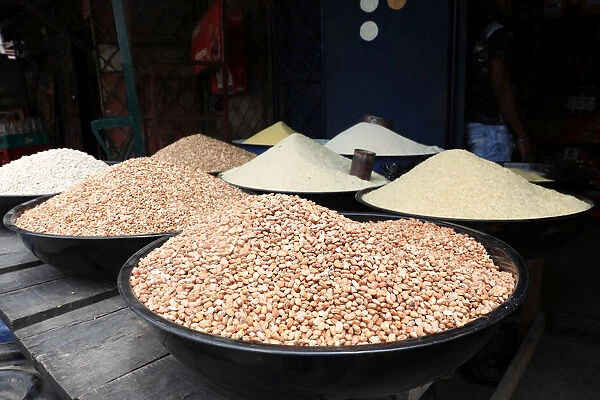 Beans and rice on display for sale are seen inside a shop at a market in Lagos