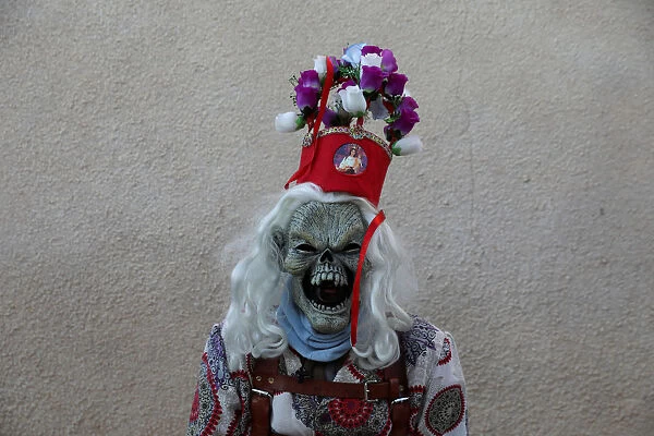 A believer dressed as a diablo (devil), poses during the Endiablada festival in