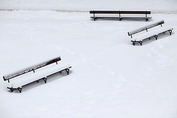 Benches are seen covered by snow at a park in the centre of Warsaw