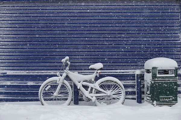 A bicycle is covered with snow near Grangemouth, Scotland