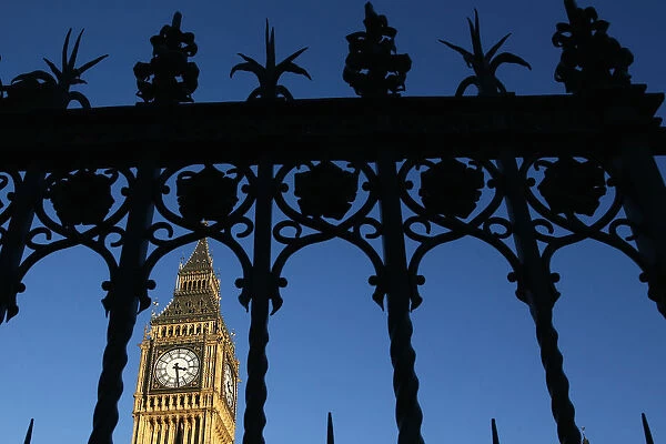 The Big Ben Clock Tower is seen through a gate, in central London