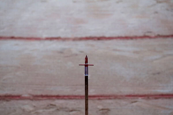 Blood is seen on a spear used by a picador (mounted bullfighter