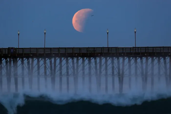 Framed Print : A Blue Moon comes out of a lunar eclipse as it sets past an ocean pier in Oceanside Framed Print : A Blue Moon comes out of a lunar eclipse as it sets past an ocean pier in Oceanside