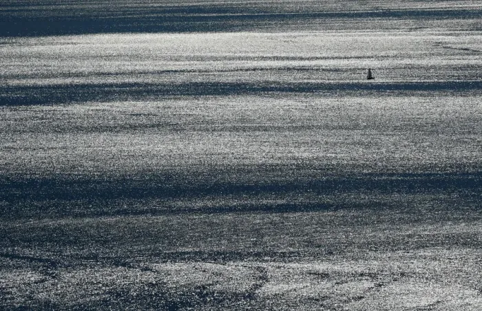 Framed Print : A boat sails on Lake Leman on a windy autumn day near Puidoux
