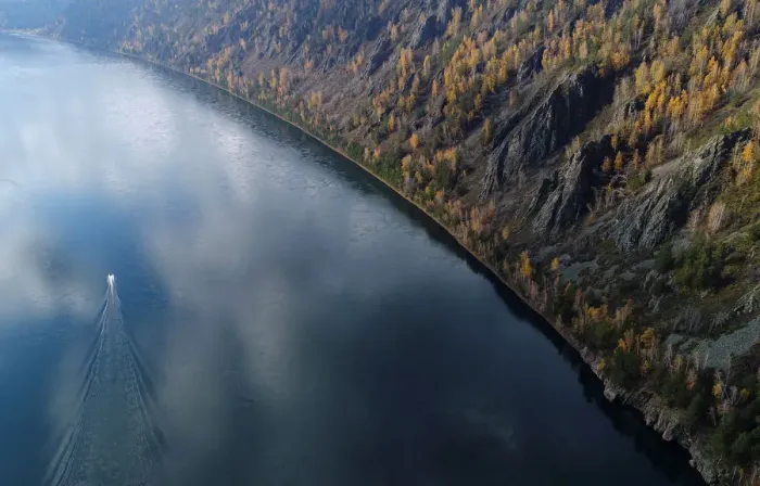 Framed Print : A boat is seen on the Yenisei River in the Siberian Taiga area outside Krasnoyarsk