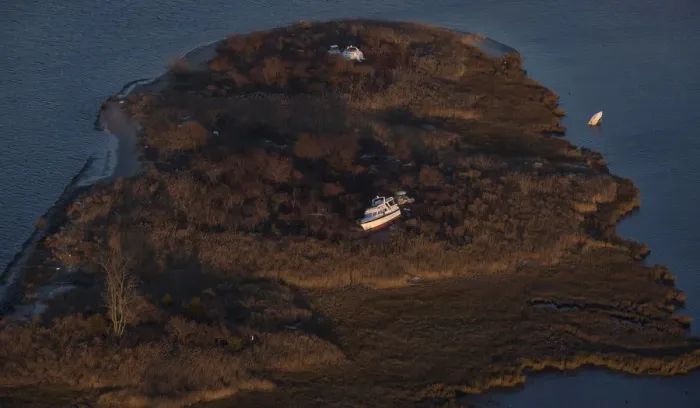 Framed Print : A boat sits in marshland, in this aerial view near Sea Bright, New Jersey