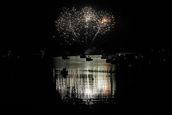Boats are silhouetted as fireworks explode marking Independence Day in Stonington, Maine