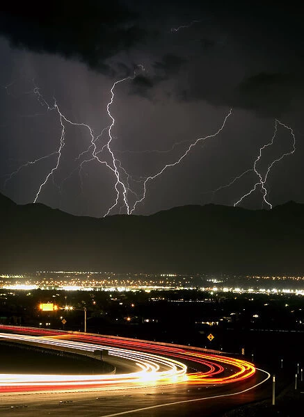 Bolts of lightning and vehicles on Interstate 215 light up northwest Las Vegas