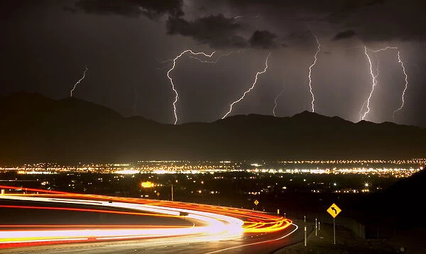 Bolts of lightning and vehicles on Interstate 215 light up northwest Las Vegas