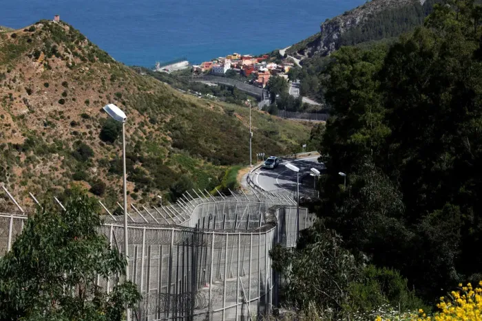 Framed Print : The border fence separating Spains northern enclave Ceuta and Morocco is seen from Ceuta