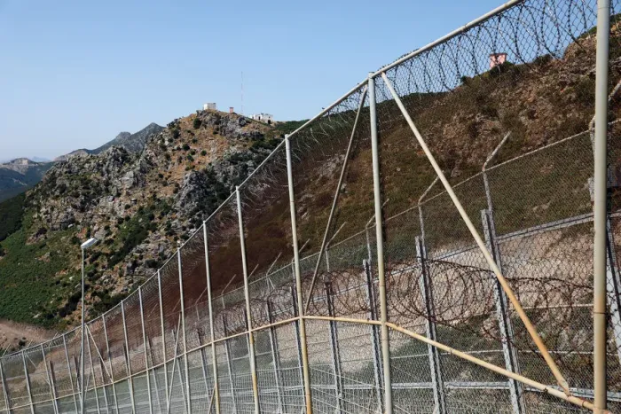 Framed Print : The border fence separating Spains northern enclave Ceuta and Morocco is seen from Ceuta Framed Print : The border fence separating Spains northern enclave Ceuta and Morocco is seen from Ceuta