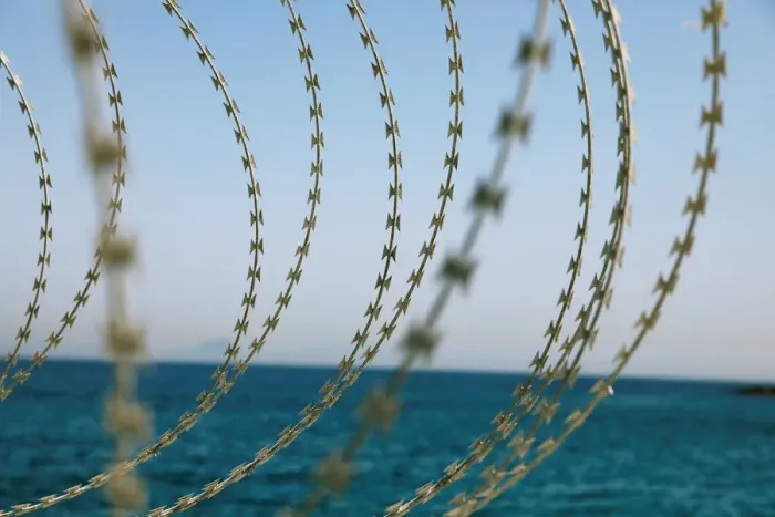 Framed Print : The border fence separating Spains northern enclave Ceuta and Morocco is seen from Ceuta