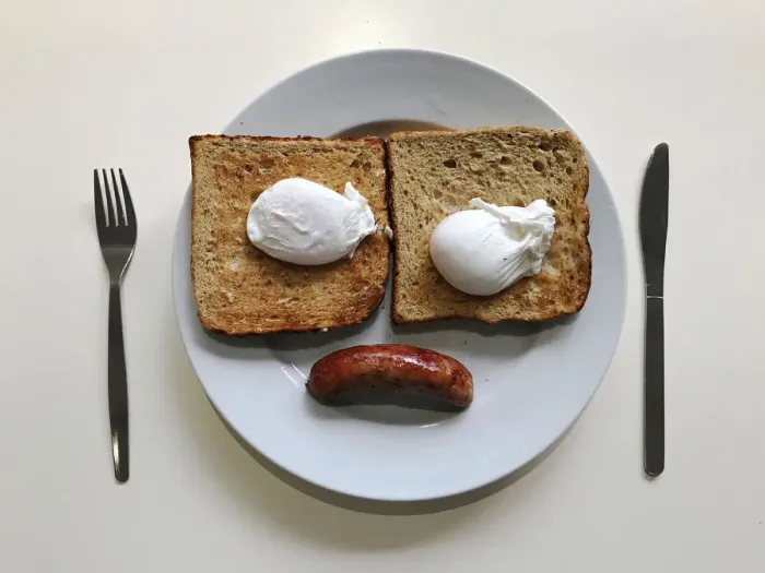 Framed Print : A breakfast of sausage, eggs and toast is pictured in an office canteen in London Framed Print : A breakfast of sausage, eggs and toast is pictured in an office canteen in London