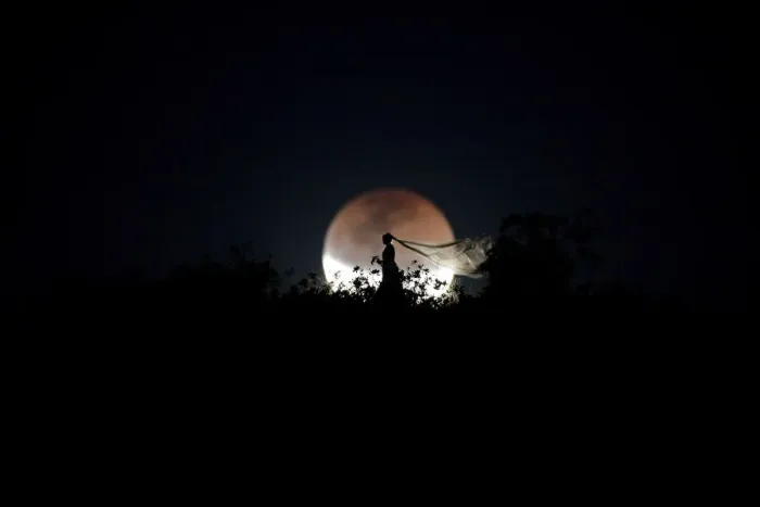 Framed Print : A bride poses for photo during a total lunar eclipse from in Brasilia Framed Print : A bride poses for photo during a total lunar eclipse from in Brasilia