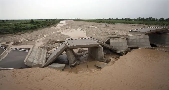Framed Print : A bridge that was damaged by the flash floods, built over a stream leading to river Tawi