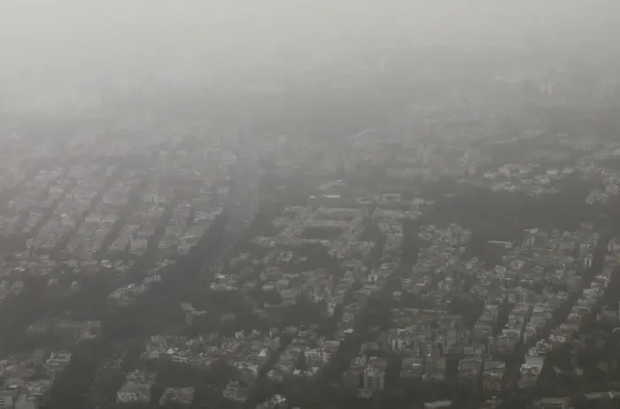 Framed Print : Buildings are seen blanketed by haze and dust in New Delhi Framed Print : Buildings are seen blanketed by haze and dust in New Delhi