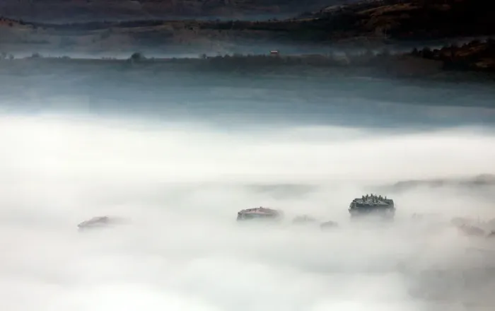 Framed Print : Buildings are seen as fog blankets the city of Skopje Framed Print : Buildings are seen as fog blankets the city of Skopje