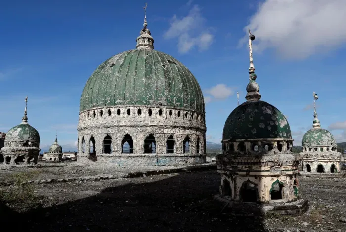 Framed Print : The bullet-riddled domes of Grand Mosque are seen, after residents were allowed to return Framed Print : The bullet-riddled domes of Grand Mosque are seen, after residents were allowed to return