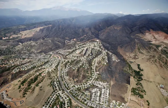 Framed Print : The burned area of hundreds of totally destroyed homes in the Waldo Canyon fire is seen