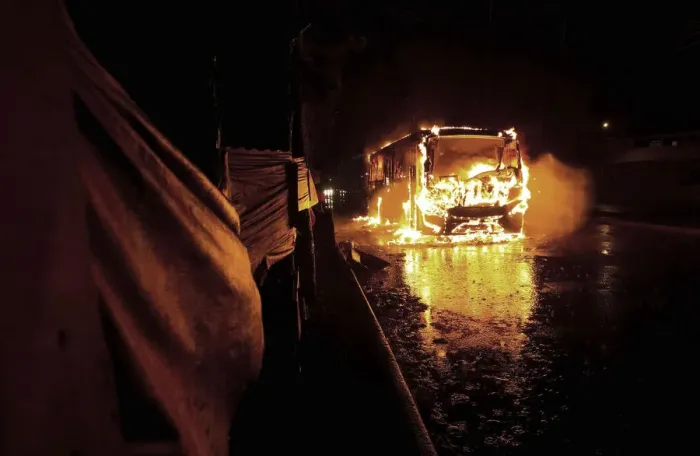 Framed Print : Bus is seen on fire in front of Pinheirinho slum where residents try to fight eviction Framed Print : Bus is seen on fire in front of Pinheirinho slum where residents try to fight eviction