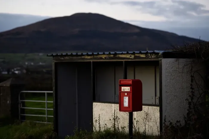 Framed Print : A bus-stop and red post box is seen in the border town of Jonesborough