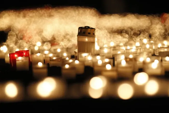 Framed Print : Candles are seen in front of the Frauenkirche in Dresden to commemorate the 67th