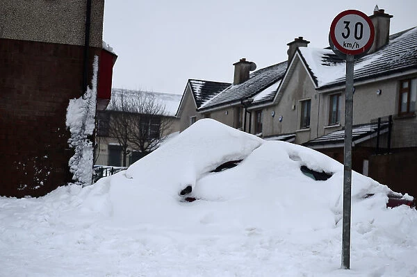 A car is covered by snow near Dublin