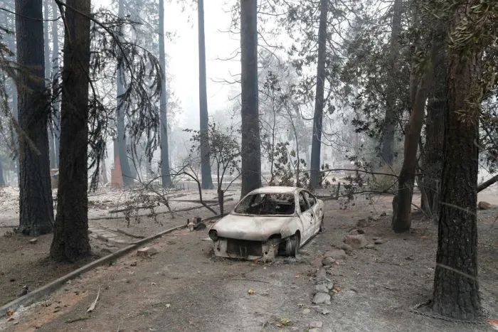 Framed Print : A car destroyed by the Camp Fire is seen in Paradise