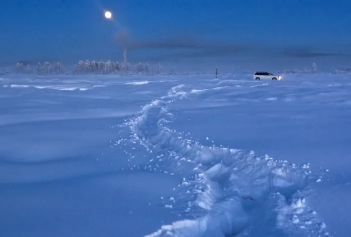 Framed Print : A car drives through the snow at night near Vostochnaya meteorological station Framed Print : A car drives through the snow at night near Vostochnaya meteorological station