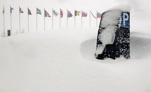 A car park ticket machine is seen during heavy snowfall in Sestriere
