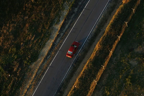 A car travels on a road near Donana Natural Reserve, southwest Spain