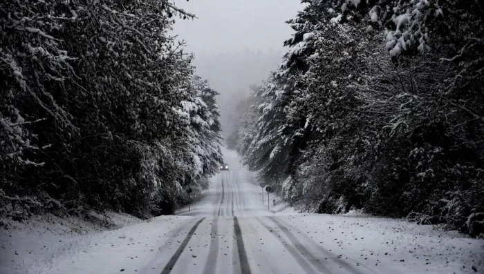 Framed Print : A car travels through a snow covered pine forest near the Basque town of Murgia Framed Print : A car travels through a snow covered pine forest near the Basque town of Murgia