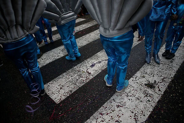 Carnival participants march during a parade in Torres Vedras