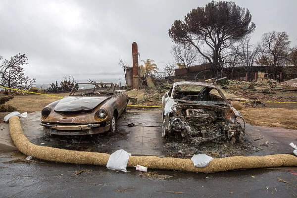 Cars were burnt in the Thomas Fire during a winter rain storm in Ventura