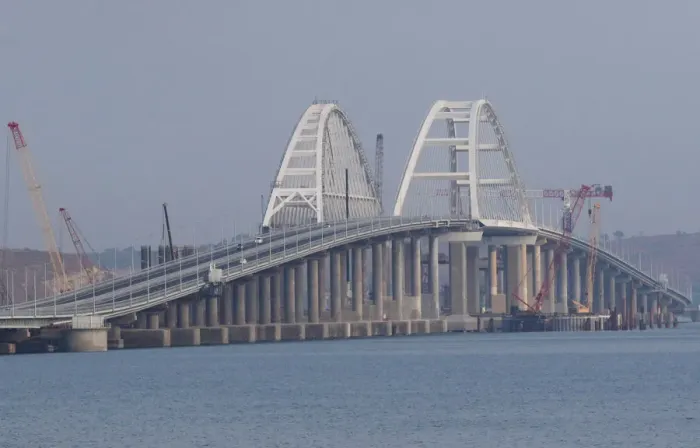 Framed Print : Cars drive along a bridge, which was constructed to connect the Russian mainland with