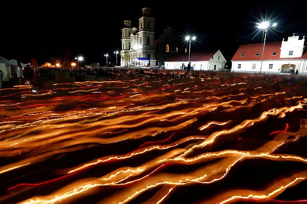 Catholics from Belarus and neighbouring countries carry candles during the annual Icon of