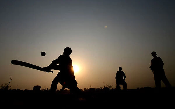 Children play cricket near the Wagah border crossing in Pakistan