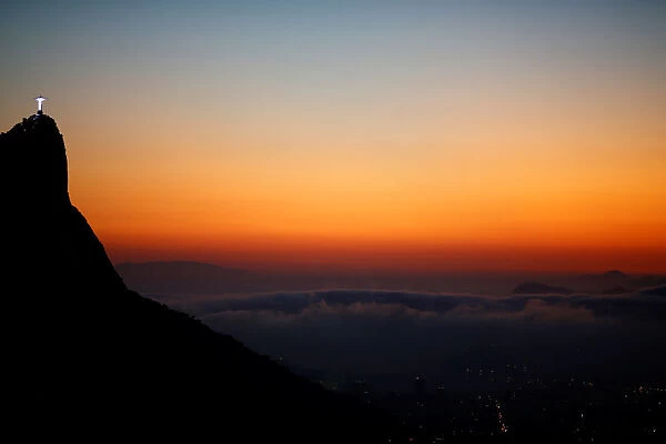 Christ the Redeemer is seen from the Vista Chinesa (Chinese View) during sunrise in Rio de Janeiro, Brazil