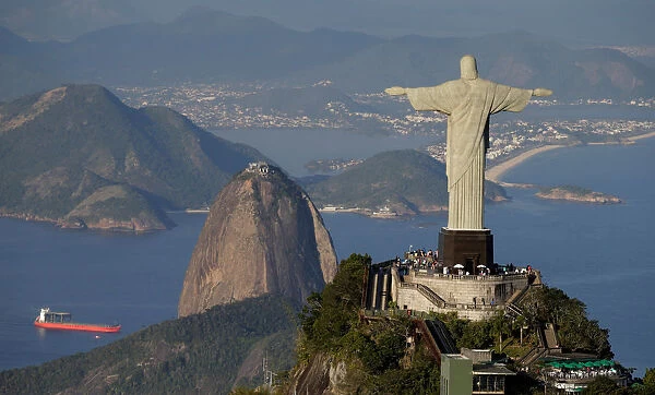 The Christ the Redeemer statue is pictured with the Sugar Loaf mountain in the background