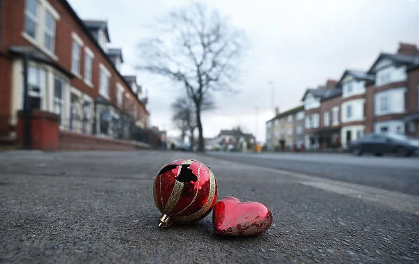Christmas baubles lie on the pavement along Warwick Road in the town of Carlisle in