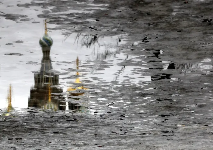 Framed Print : The Church of the Savior on Spilled Blood is reflected in melting ice on Arts Square in