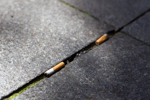 Cigarette butts litter the street in Lyon
