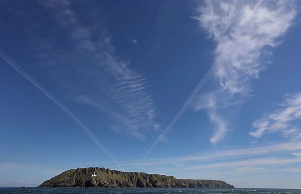 Cirrus clouds and contrails are seen above the island of Lundy