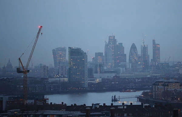 The City of London financial district is seen during early morning mist from Greenwich