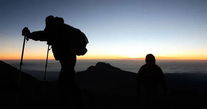 Framed Print : Climbers walk up the steep gravel and scree slope leading to the summit of Tanzania s