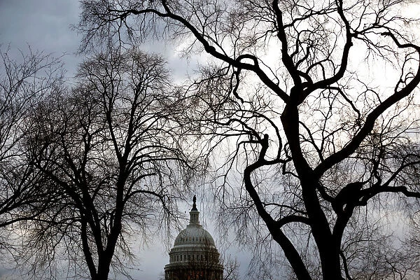 Clouds pass over the U. S. Capitol at the start of the third day of a shut down of the