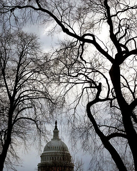 Clouds pass over the U. S. Capitol at the start of the third day of a shutdown of the