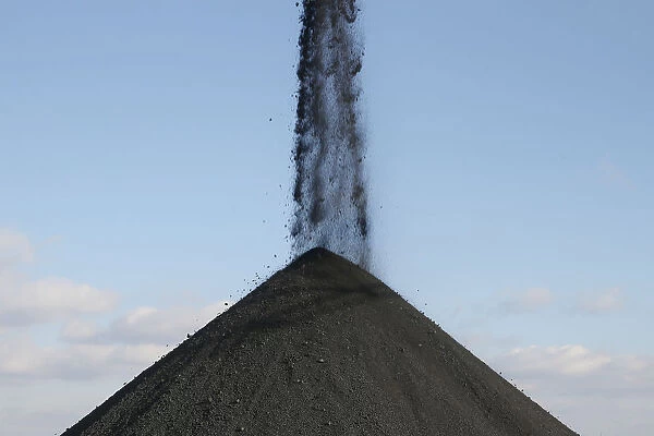 Coal is sorted into a pile at a warehouse of the Trypillian thermal power plant in Kiev